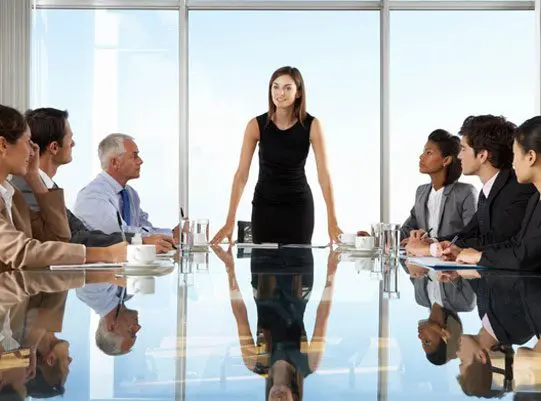 A group of people sitting around a table.